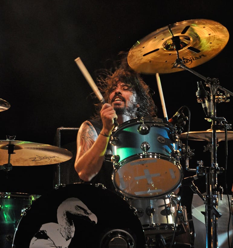 Dave Grohl playing his DW kit live, mid-stroke