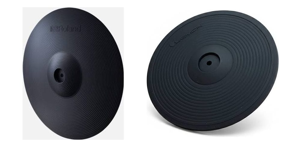 A Roland V-Cymbal pad next to a Lemon cymbal pad, both black ribbed rubber with a raised centre boss, near enough identical in shape
