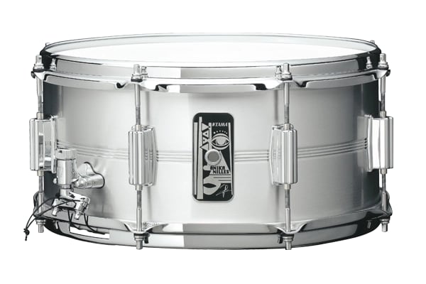 The Tama AN1465 Anika Nilles signature snare, a 14 by 6.5 inch brushed aluminium drum with her own badge design on the shell