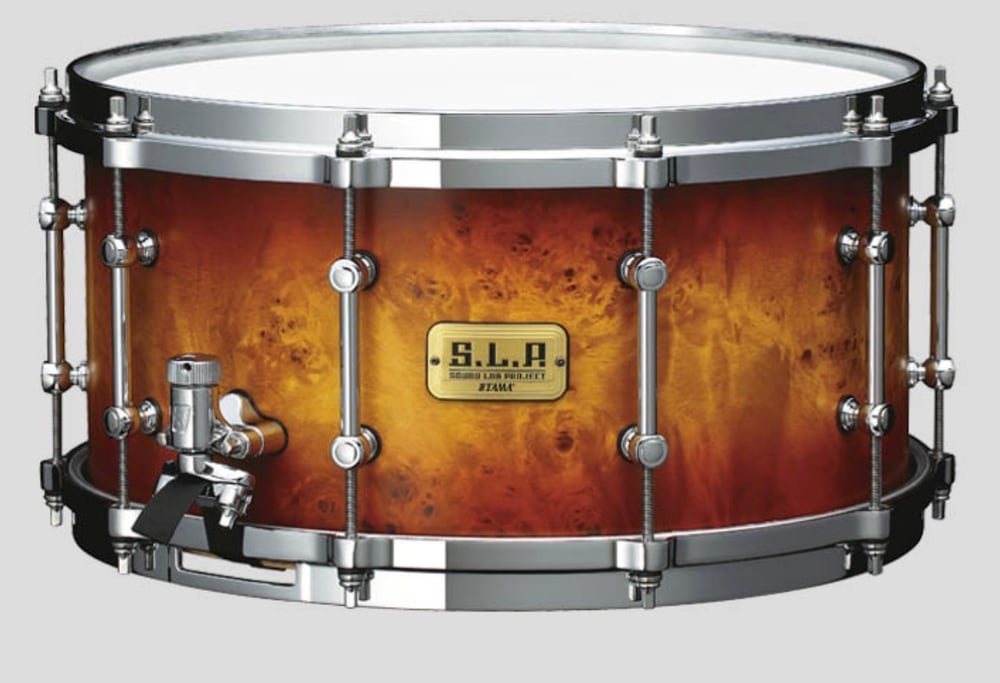 The Tama S.L.P. G-Maple 14 by 7 inch snare with a Twilight Mappa Burl outer ply, showing the burl grain fading from amber to dark brown