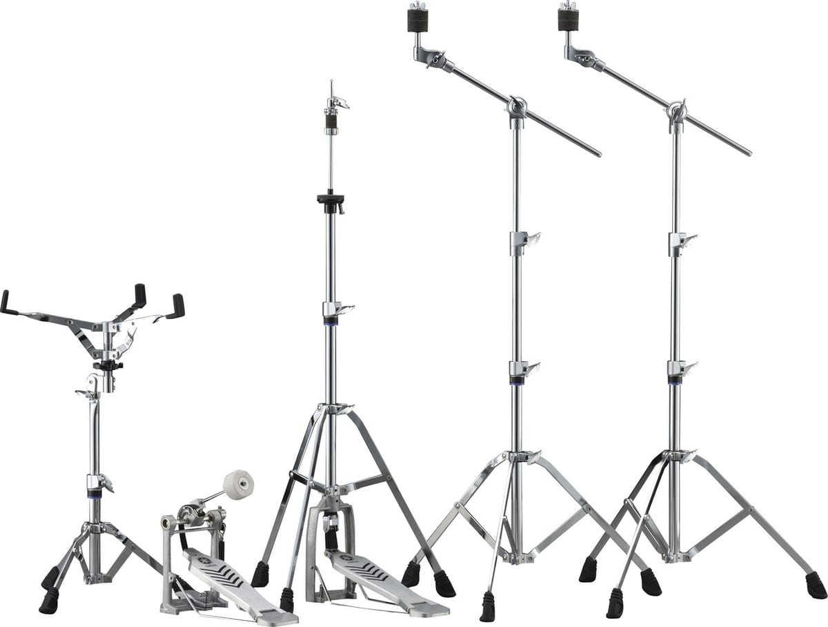 A single-braced Yamaha hardware set — snare stand, bass drum pedal, hi-hat stand and two boom cymbal stands, all in chrome with blue accent rings