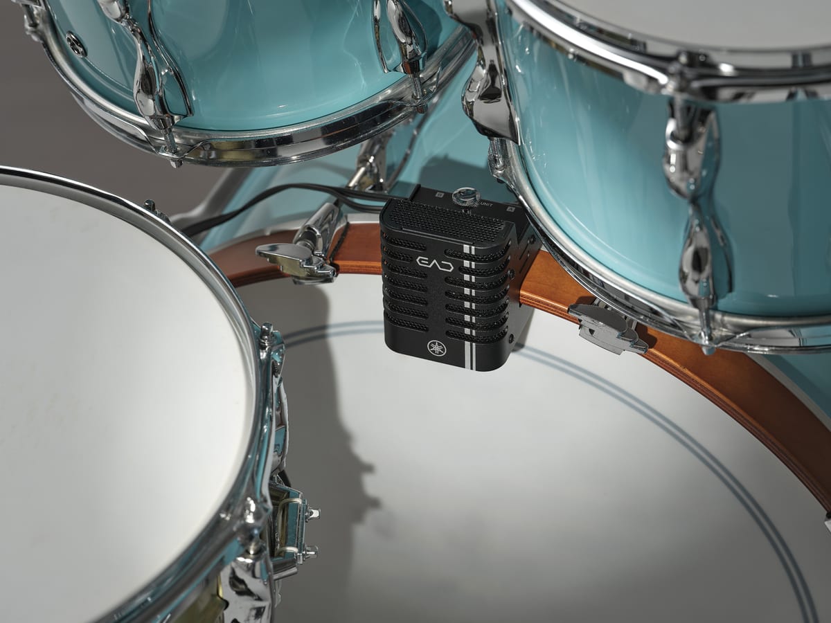 The Yamaha EAD20 sensor unit clamped to the wooden hoop of a bass drum, sitting between the snare and the rack toms
