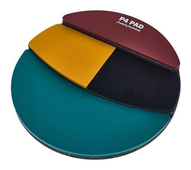 The Drumeo P4 practice pad with its four coloured surfaces: a large teal pad, a yellow and a black strip, and a red top section