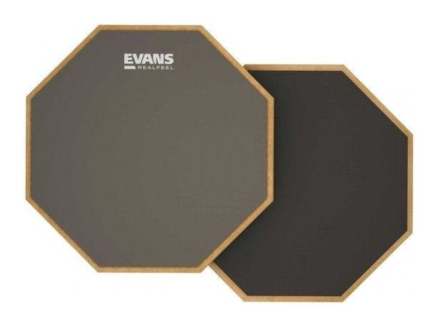 An Evans RealFeel two-sided practice pad, showing the grey gum rubber side and the darker recycled rubber side