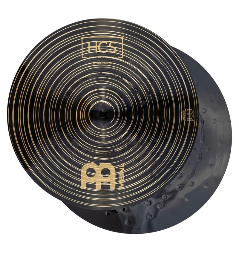 Close-up of the 14-inch Meinl HCS Dark hi-hat cymbals, black with gold lathing rings, the HCS logo and the Meinl logo